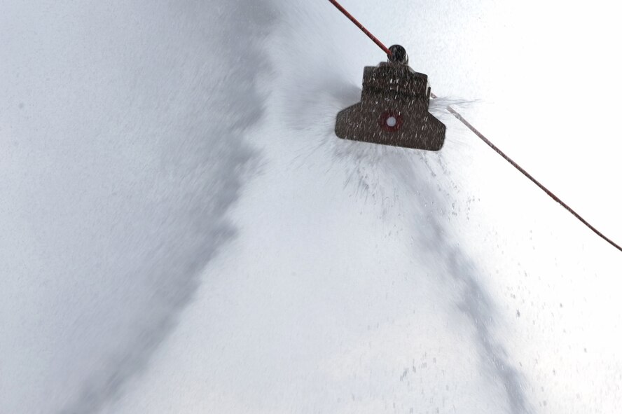 A target attached to a line gets sprayed by Airmen from the 2nd Force Support Squadron and the 2nd Civil Engineer Squadron during the hose joust for the third annual Fire Muster on Barksdale Air Force Base, La., June 10. The members from each squadron must use a fire hose to spray a target to the opposite side. Fire musters are held for friendly competition, boost morale and to display firefighter craftsmanship. (U.S. Air Force photo/Airman 1st Class Micaiah Anthony)(RELEASED)