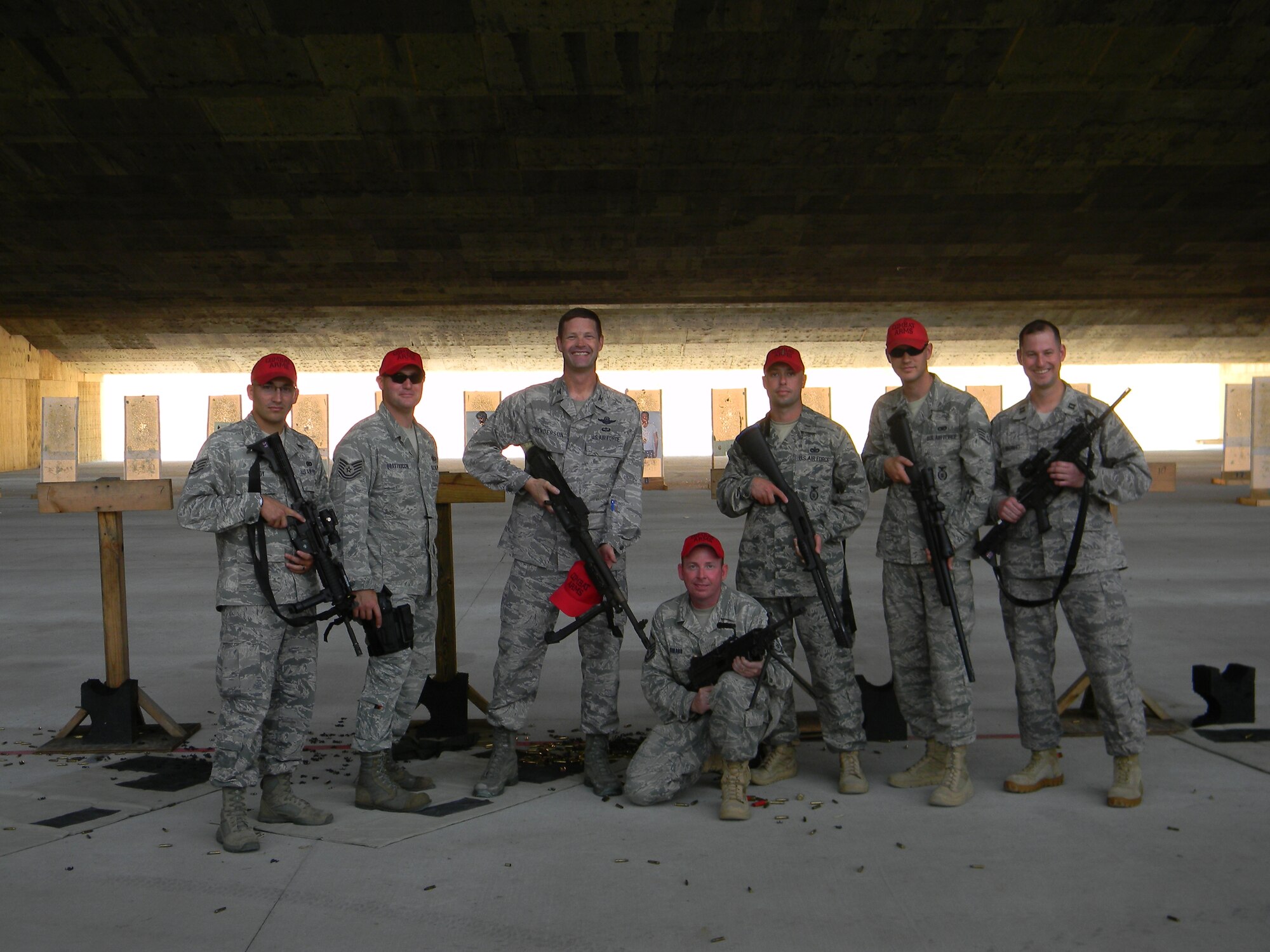U.S. Air Force Col. Gary Henderson, 23rd Wing commander, third from left, poses for a photo with members of the 23rd Security Forces Squadron combat arms training maintenance flight June 3 at Moody Air Force Base, Ga. Colonel Henderson hit a perfect 45 of 45 while qualifying with an M9 pistol. (courtesy photo/Released)  