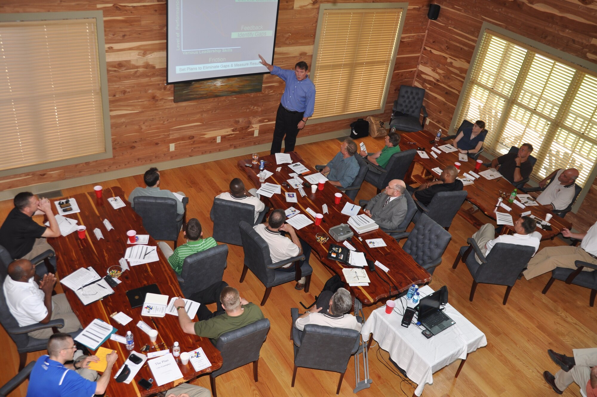 Author and motivational speaker Jim Hunter speaks to members of the BLAZE Leadership Team Saturday, June 4 during a leadership off-site at the Prairie Wildlife hunting lodge. (US Air Force Photo/Sonic Johnson)