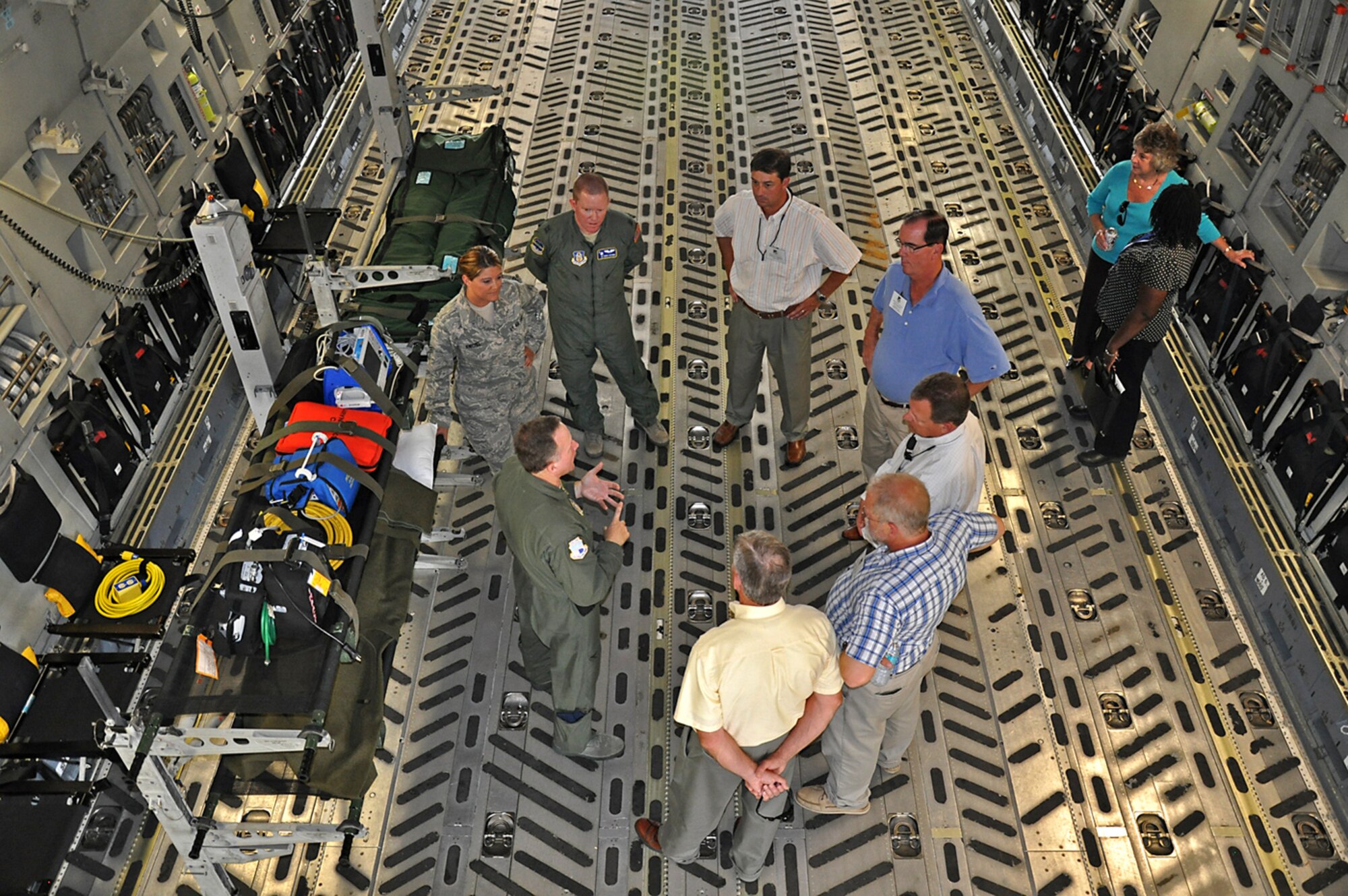 Members of the 315th Aeromedical Evacuation Squadron describe how the C-17 Globemaster can be converted into a flying hospital while a group a civic leaders from Maxwell Air Force Base, Ala. eagerly listens June 9, 2011.   (Air Force photo by Michael Dukes)
