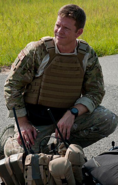 U.S. Air Force Capt. Matthew Bury, 38th Rescue Squadron combat rescue officer, listens to a final mission brief before putting on his equipment during a medical evacuation training exercise June 9 at Moody Air Force Base, Ga. Several pararescuemen from the 38th RQS participated in the exercise to prepare for an upcoming deployment. (U.S. Air Force photo by Senior Airman Benjamin Wiseman/Released)