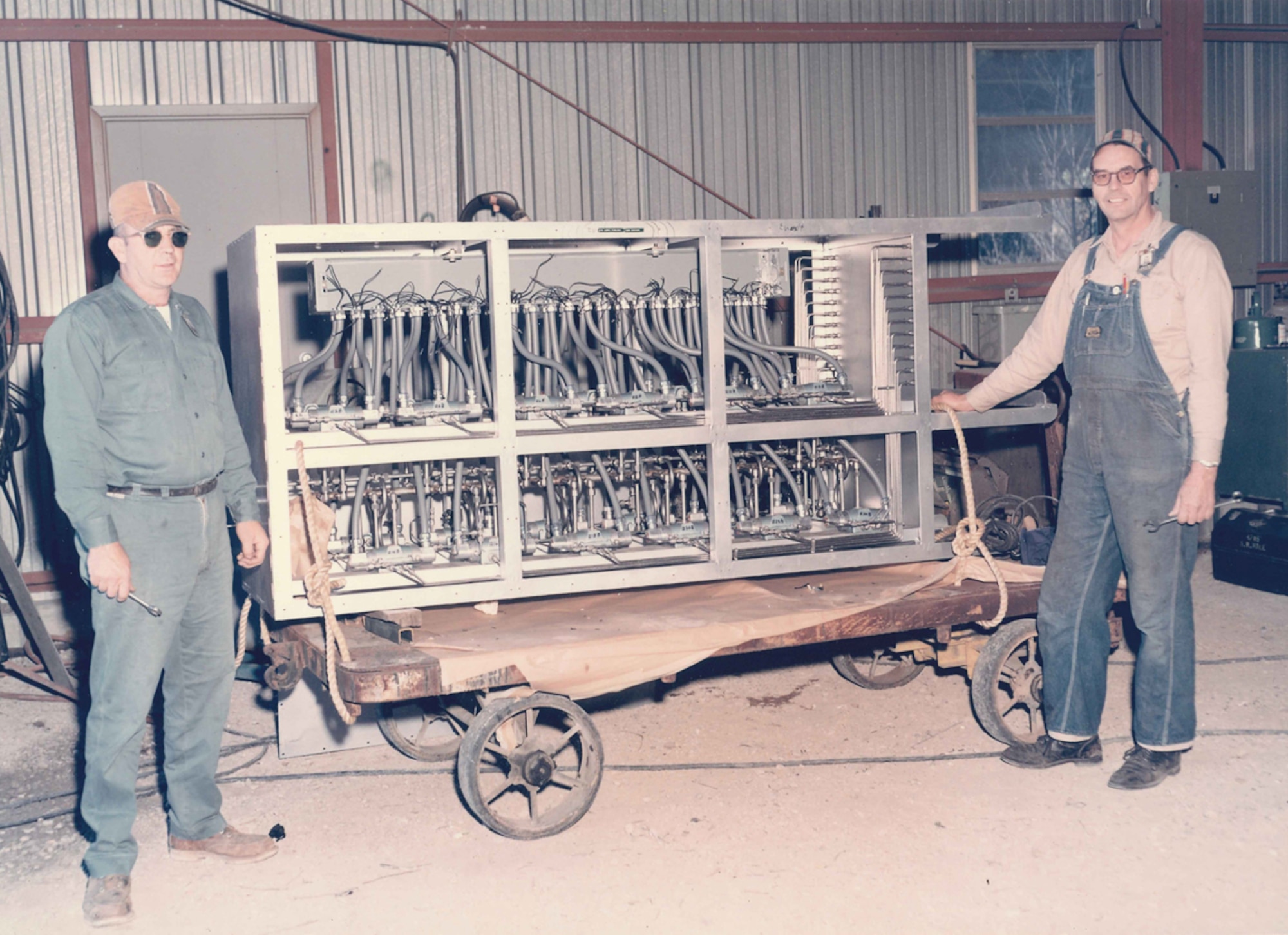 Bower (on right) is pictured with a control panel he helped fabricate for a venturi closure in the J-2 test cell on Oct. 16, 1970. (Photo provided)