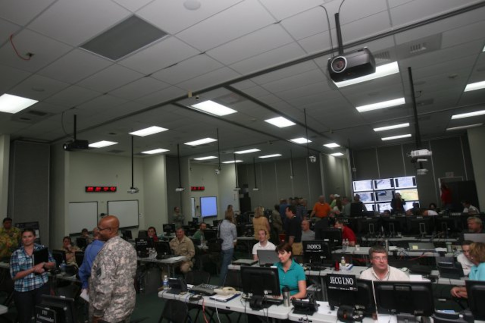 Personnel monitor, analyze and exploit imagery  while participating in the Empire Challenge 2011 demonstration at Fort Huachuca, Ariz.. A multi-service team that resides at the Electronic Systems Center, the Distributed Common Ground/Surface System (DCGS) Multi-Service Execution Team Office,  facilitates the information-sharing infrastructure for EC. (U.S. Army photo by Amy McLaughlin)
