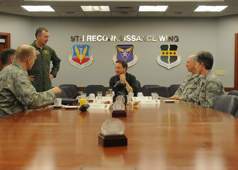 Gary Sinise, actor and military supporter, receives the 9th Reconnaissance Wing Unit mission brief from Brig. Gen. Paul McGillicuddy, 9th RW commander, June 7, 2011 prior to beginning the training to take a high flight to 70,000 feet in the U-2 Dragon Lady. Mr. Sinise was visiting Beale to document the mission of the U-2 Dragon Lady and meet with Airmen to boost morale. 