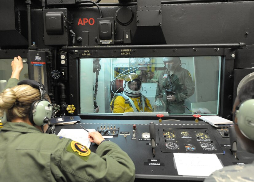 Airmen from the 9th Physiological Support Squadron operate the altitude chamber at Beale Air Force Base, Calif., June 7, 2011 while Gary Sinise, actor and military supporter, prepares to experience loss of cabin pressure at 70,000 feet elevation in preparation for a high flight in the U-2 Dragon Lady. Mr. Sinise was visiting Beale to document the mission of the U-2 Dragon Lady and meet with Airmen to boost morale. 