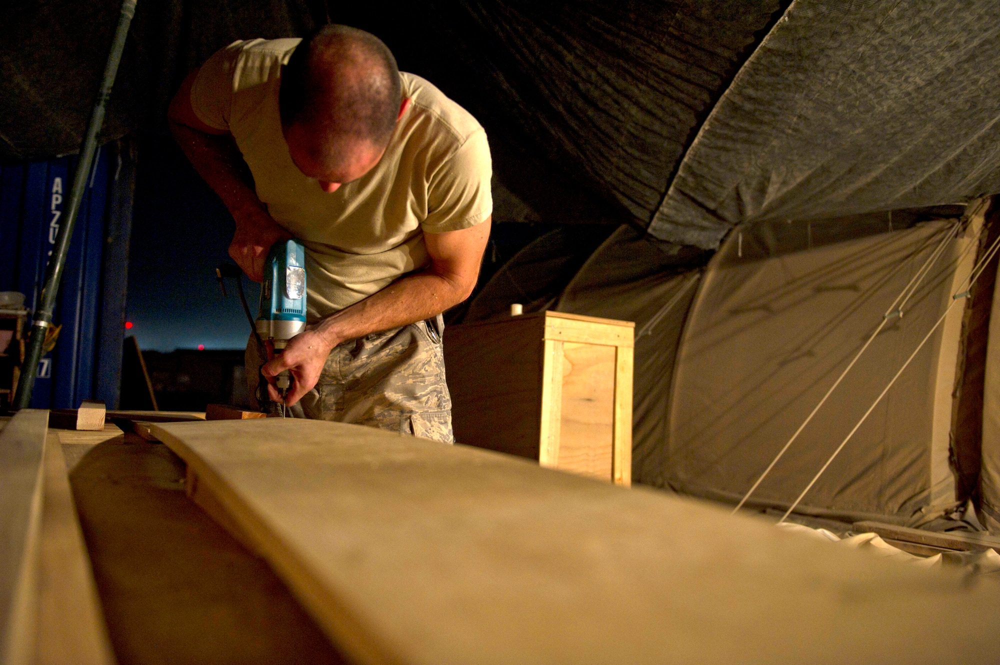 Master Sgt. Jason Reininger builds a child-size coffin to be turned over to the hospital at Camp Bastion, Afghanistan. Sergeant Reininger is an aerospace medical technician assigned to the 451st Expeditionary Aeromedical Evacuation Squadron. (U.S. Air Force photo/Master Sgt. Adrian Cadiz) 