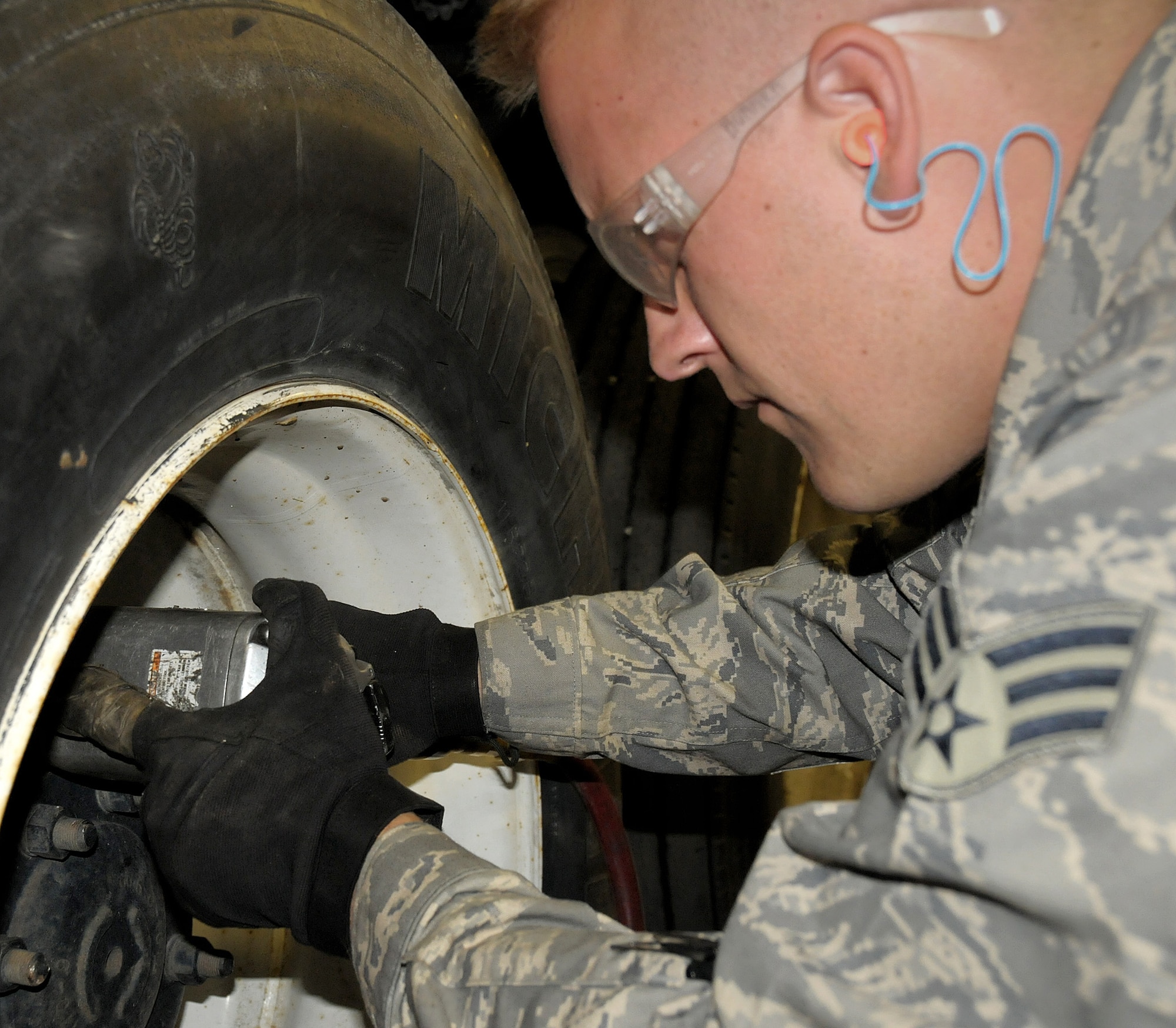 Senior Airman Tobias Burrier from Vehicle Maintenance, Logistics Readiness Squadron, 146th Airlift Wing, Channel Islands Air National Guard Station, Calif. rotates tires on a five-ton truck at Joint Base Elmendorf-Richardson, Anchorage, Alaska June 9, 2011. The Air Terminal Operations Squadron, Logistics Readiness Squadron, and the Security Forces Squadron traveled to Alaska to complete their respective annual training requirements. (Photo by Tech. Sgt. Alex Koenig)