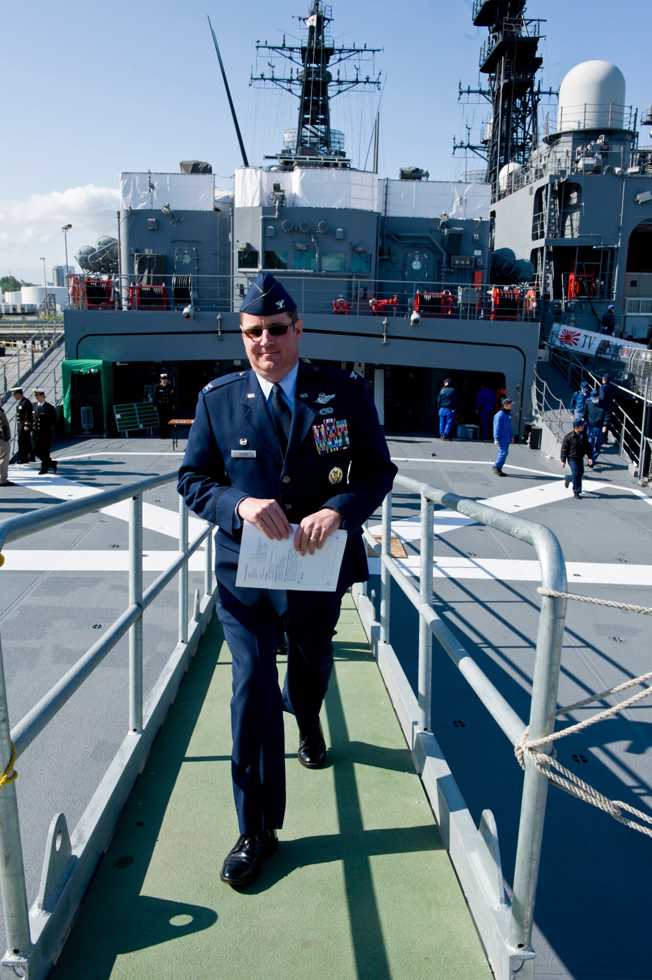 Commander, Joint Base Elmendorf-Richardson and 673 Air Base Wing, Colonel Robert Evans disembarks the JMSDF Kashima after a tour of the ship June 6. (U.S. Air Force photo/Johnathon Green)
