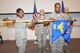 U.S. Air Force Senior Airman Nadia Katana, left, and Master Sgt. Thomas Javis, furl the 505th Distributed Warfare Group guidon during an Inactivation Ceremony at Kirtland Air Force Base, N.M., June 10, 2011. Officials from the 505th Command and Control Wing, Hurlburt Field, Fla., inactivated the group for a reorganization that will enhance command and control testing, tactics development and training for Air Force, joint and coalition warfighters. The 505th Combat Training Squadron, at Hurlburt Field and represented by Airman Katana, and 705th Combat Training Squadron, at Kirtland AFB and represented by Sergeant Javis, will be aligned under the wing's 505th Training Group, Hurlburt Field, and 505th Test and Evaluation Group, Nellis Air Force Base, Nev. In the background are Col. Mustafa R. Koprucu, 505th CCW commander, and Col. William A. Reese, 505th DWG commander. (U.S. Air Force photo by Elizabeth Martinez/Released)
