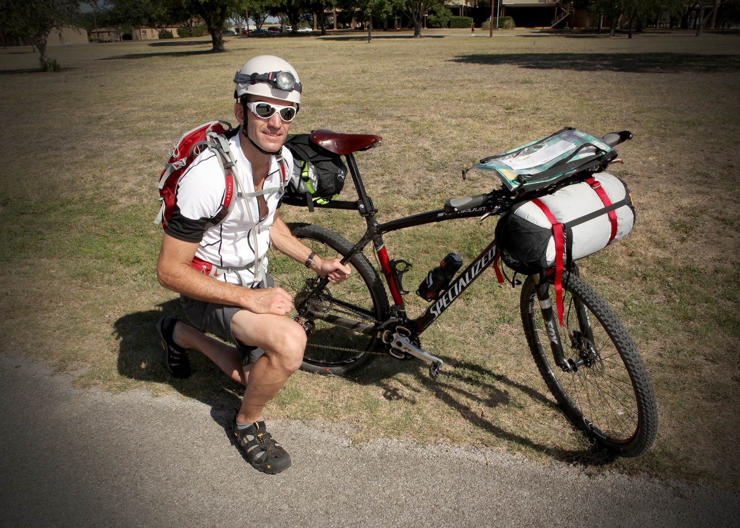 Dale Shadley, a woodworker at the arts and crafts center, prepares his specialized bike for the Tour Divide race June 11. (U.S. Air Force photo/Robbin Cresswell)