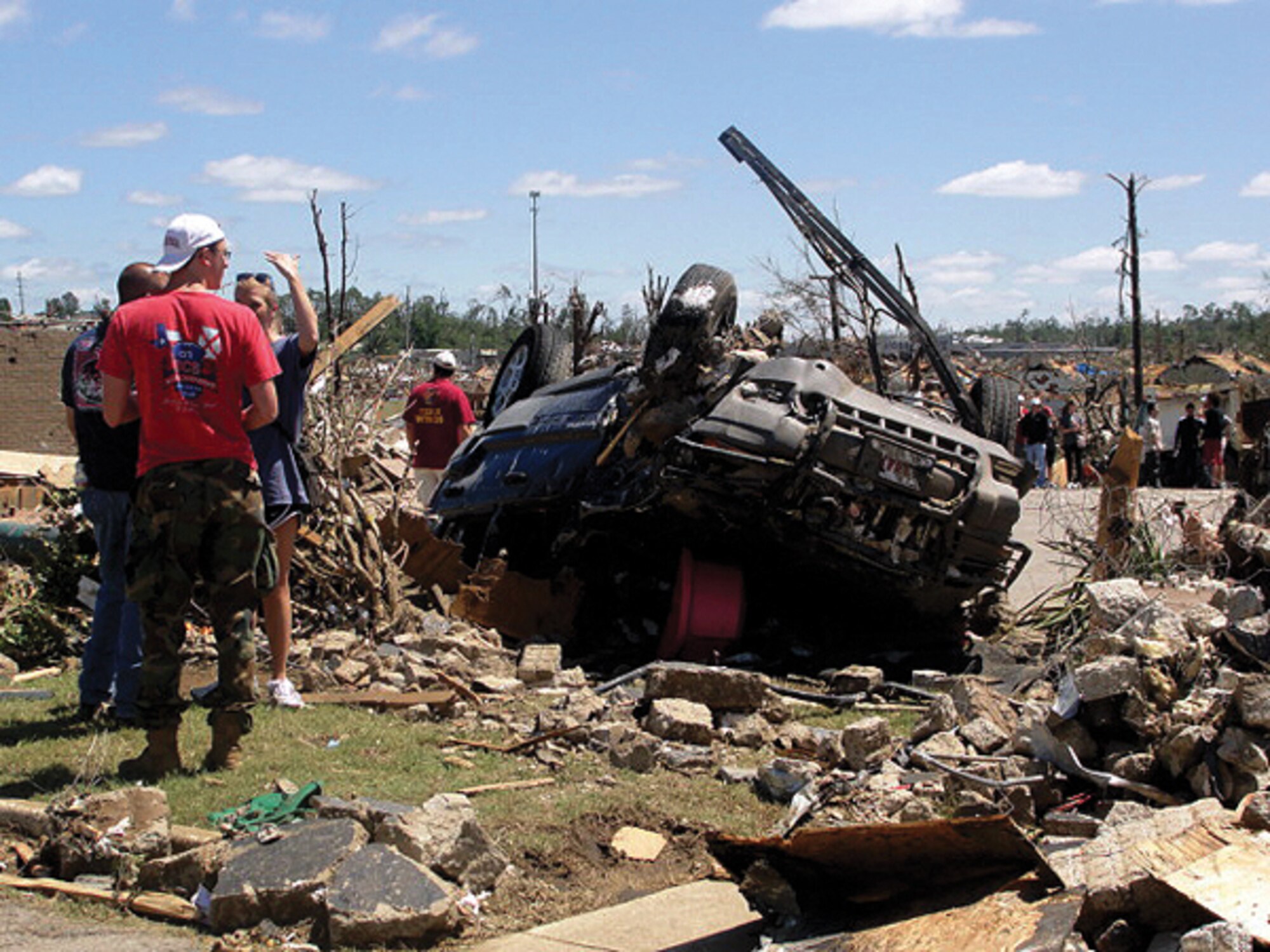 On April 27, a wedge tornado measuring about a mile wide struck northern Alabama, wreaking destruction all the way from Tuscaloosa to Birmingham. Above, local residents survey the damage.