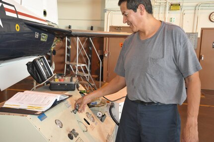 Roger Arredondo, 12th Flying Training Wing aircraft maintenance, uses a hydrolic mule to test the hydrolics of a T-6 Texan II aircraft during a phase inspection May 24 at Randolph Air Force Base.  (U.S. Air Force photo/Airman Alexis Siekert) (released)