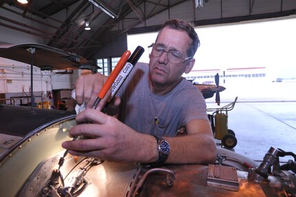 Richard Peterson, 12th Flying Training Wing aircraft maintenance, inspects the engine of a T-6 Texan II aircraft during a phase inspection May 19 at Randolph Air Force Base.  (U.S. Air Force photo/Airman Alexis Siekert) (released)