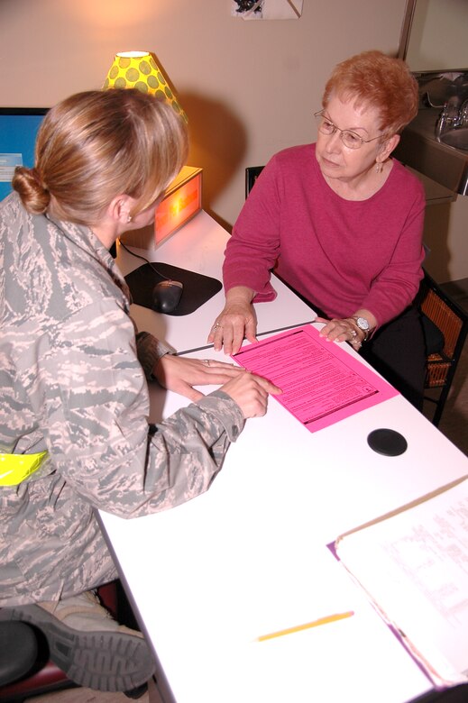 Maj. (Dr.) Katie Crowder, 60th Medical Operations Squadron Family Medicine Clinic physician reviews advance directive options with Ms. Billie Evans at David Grant USAF Medical Center. DGMC's Family Medicine clinic is educating patients on preparing advance directives, including various end-of-life forms, key differences between the forms and their purpose and importance. (U.S. Air Force photo/James Spellman)