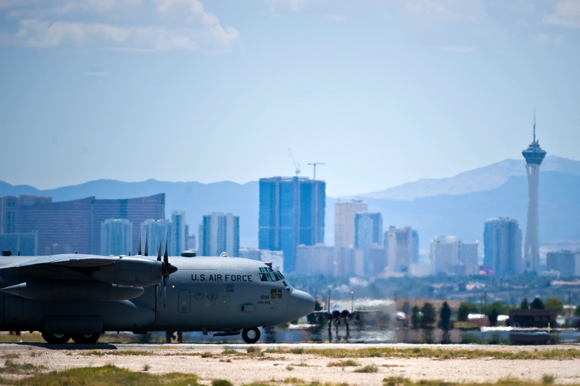 NELLIS AIR FORCE BASE, Nev.-- A C-130 Hercules assigned the U.S. Air Force Weapons School taxis across the Nellis Flightline during the Mission Employment phase, June 8, 2011. More than 5,000 personnel are involved in the final phase of the Weapons School graduate course, resulting in 89 students from 21 separate combat specialties graduating as U.S. Air Force Weapons Officers. (U.S. Air Force photo by Senior Airman Brett Clashman)