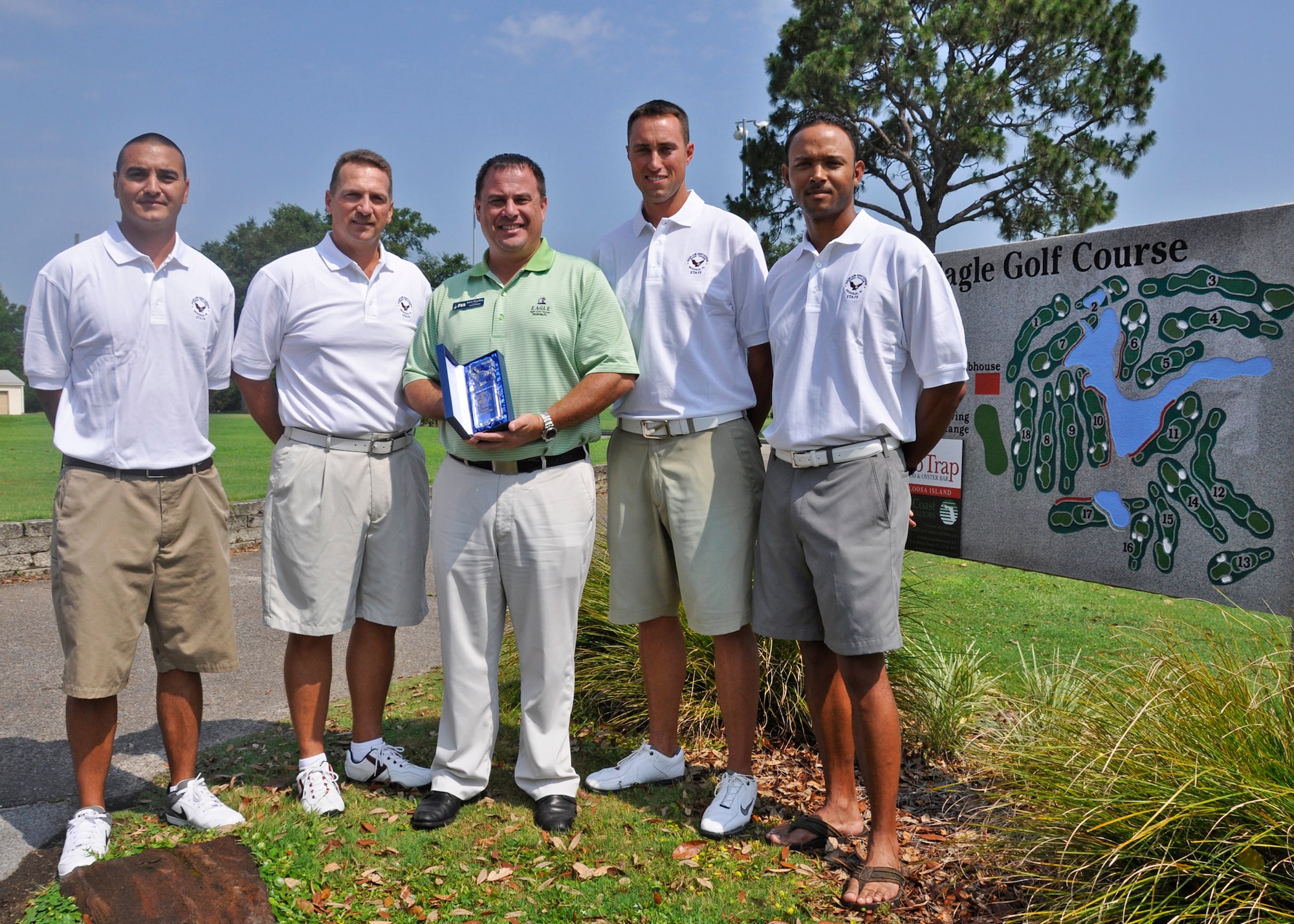 From left, Christian Honda, Roger Bloor, Kyle Wesolowski and Jason Hadley present the second-place trophy they recently won at the 47th Southeastern Military Invitational in Jacksonville, Fla., to Jason Woodling, Eglin Golf Course acting manager (middle).  Wesolowski and Bloor placed first and second in individual competition, respectively. (U.S. Air Force photo/Kevin Gaddie) 