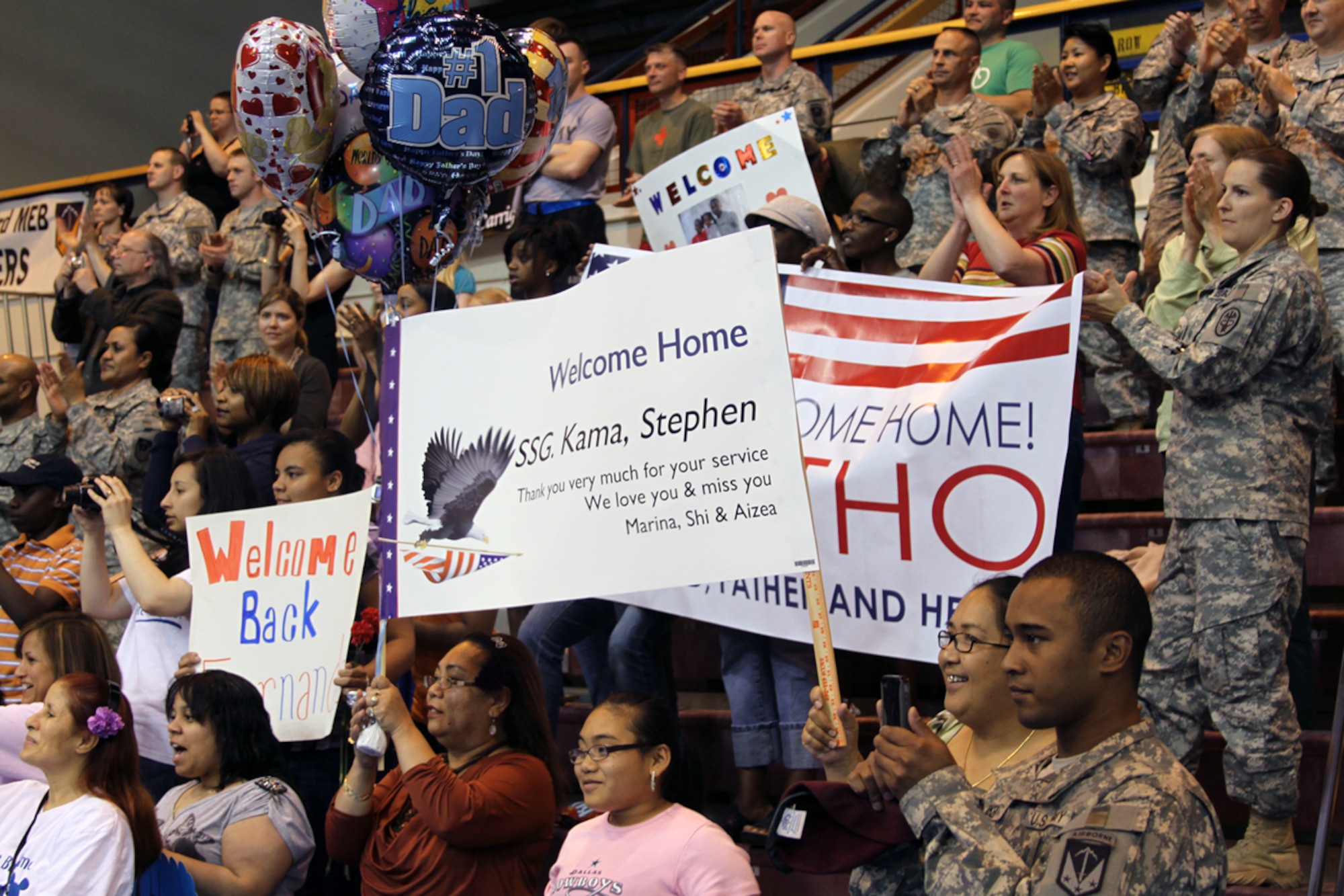 Families and friends cheer the arrival of 17th Combat Sustainment Support Battalion Soldiers, home from deployment, Monday, at Buckner Physical Fitness Center on Joint Base Elmendorf-Richardson.  (Photo by Army Staff Sgt. Jason Epperson/3rd MEB PAO)