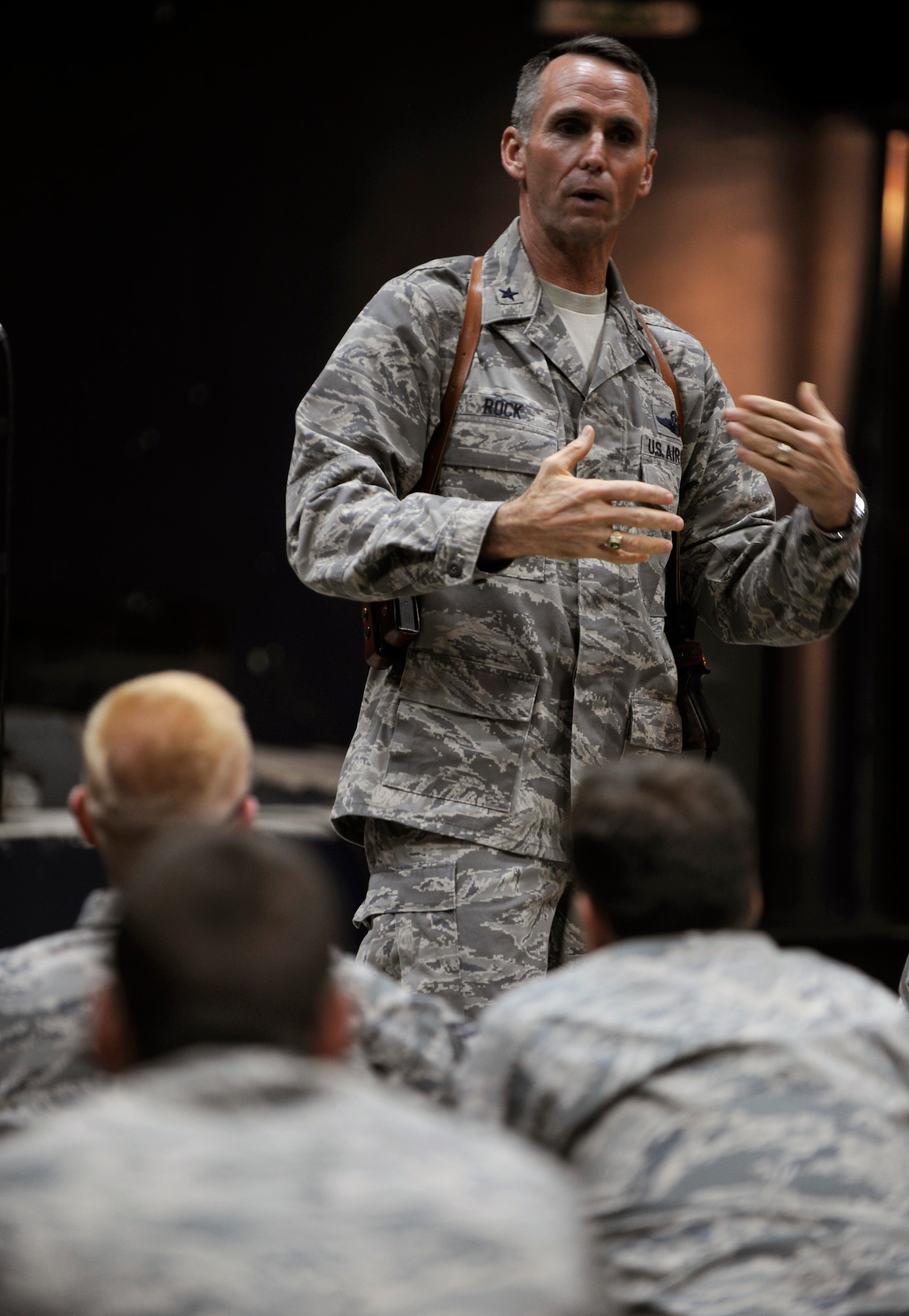 CAMP TAJI, Iraq -- Brig. Gen. Anthony Rock, Iraq Training and Advisory Mission - Air director, discusses the road ahead with Airmen and Soldiers assigned to the 321st Air Expeditionary Wing and ITAM-Air during a commander's call June 8. After awarding coins to some of the base's outstanding performers, General Rock spoke to dozens of advisors about upcoming challenges as U.S. military forces prepare for the upcoming Dec. 31 deadline. (U.S. Air Force/Tech. Sgt. Jason Lake) 