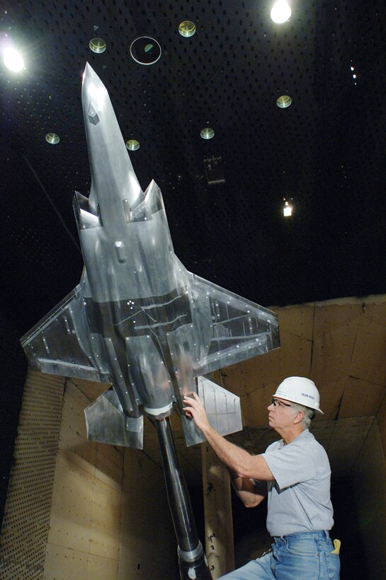 A Lockheed martin engineer inspects a model of the F-35 Joint Strike Fighter Lightning II during a break in aerodynamics load testing in AEDC's 16-foot transonic wind tunnel in 2006. (file photo)