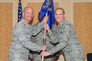 Lt. Col. Lynnette Herbert assumes command of the 718th Intelligence Squadron from Col. Jonathan Ellis, 940th Operations Group commander, during the squadron activation ceremony at Langley Air Force Base, Va., June 7, 2011. The unit was activated to expand the intelligence force within the Air Force Reserve Command. (U.S. Air Force photo by Staff Sgt. Ashley Hawkins/Released)