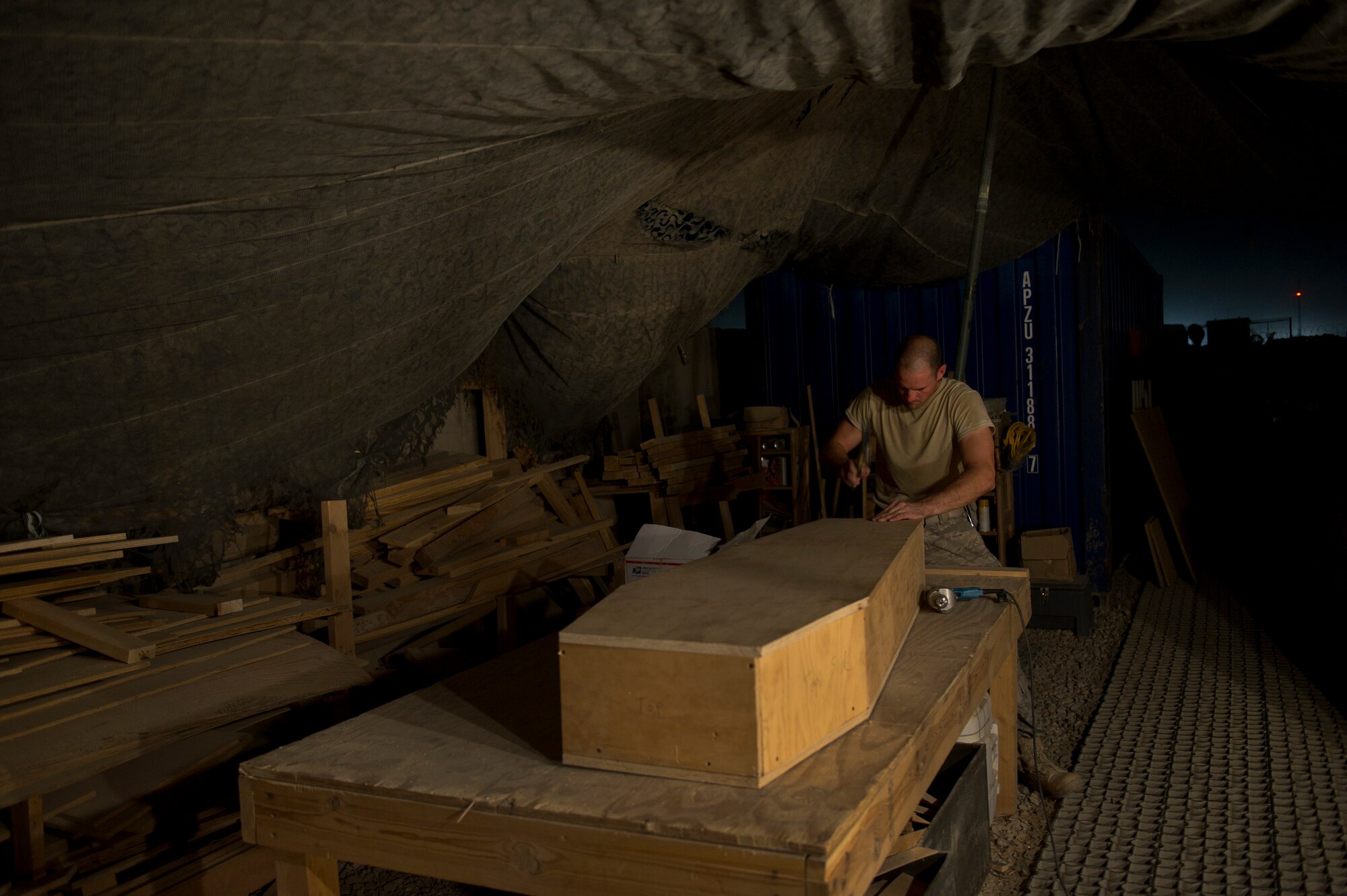 Master Sgt. Jason Reininger, 451st Expeditionary Aeromedical Evacuation Squadron Detachment 1 Contingency Aeromedical Staging Facility, aerospace medical technician, builds a child-size coffin that will be turned over to the Role 3 hospital at Camp Bastion, Afghanistan. Sgt. Reininger volunteered to build the coffin after finding out there was a need for one. Sgt. Reininger is a Reservist deployed from the 419th Medical Squadron, Hill AFB, Utah. (U.S. Air Force photo by Master Sgt. Adrian Cadiz)