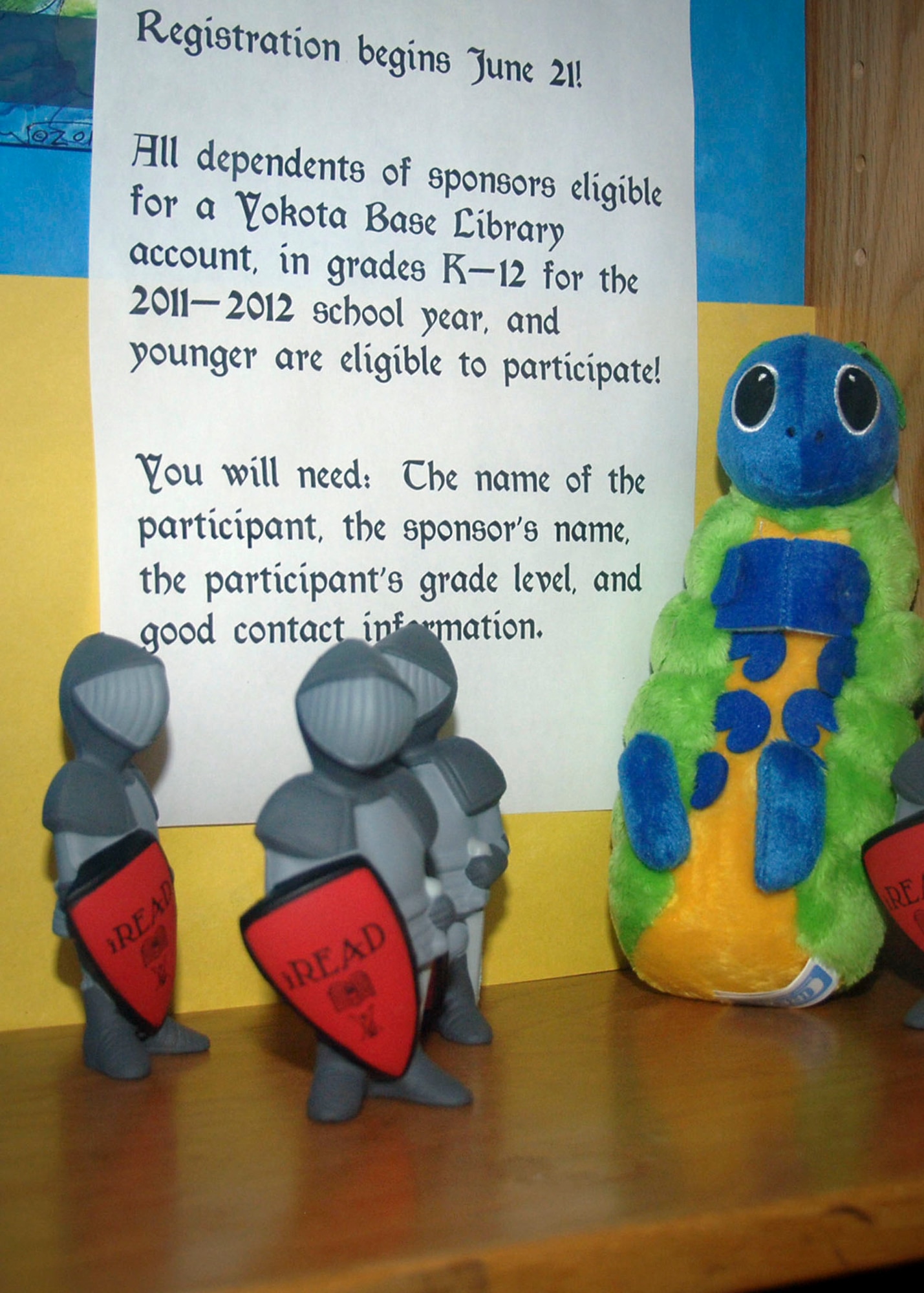 YOKOTA AIR BASE, Japan -- Toy knights are displayed in front of a registration requirement flyer for the annual summer reading program inside the library at Yokota Air Base, Japan, June 9, 2011. The program begins June 21 with registration from 10 a.m. to 5 p.m. at the base library, but participants may register at any point during the summer. (U.S. Air Force photo/Airman 1st Class Katrina R. Menchaca)