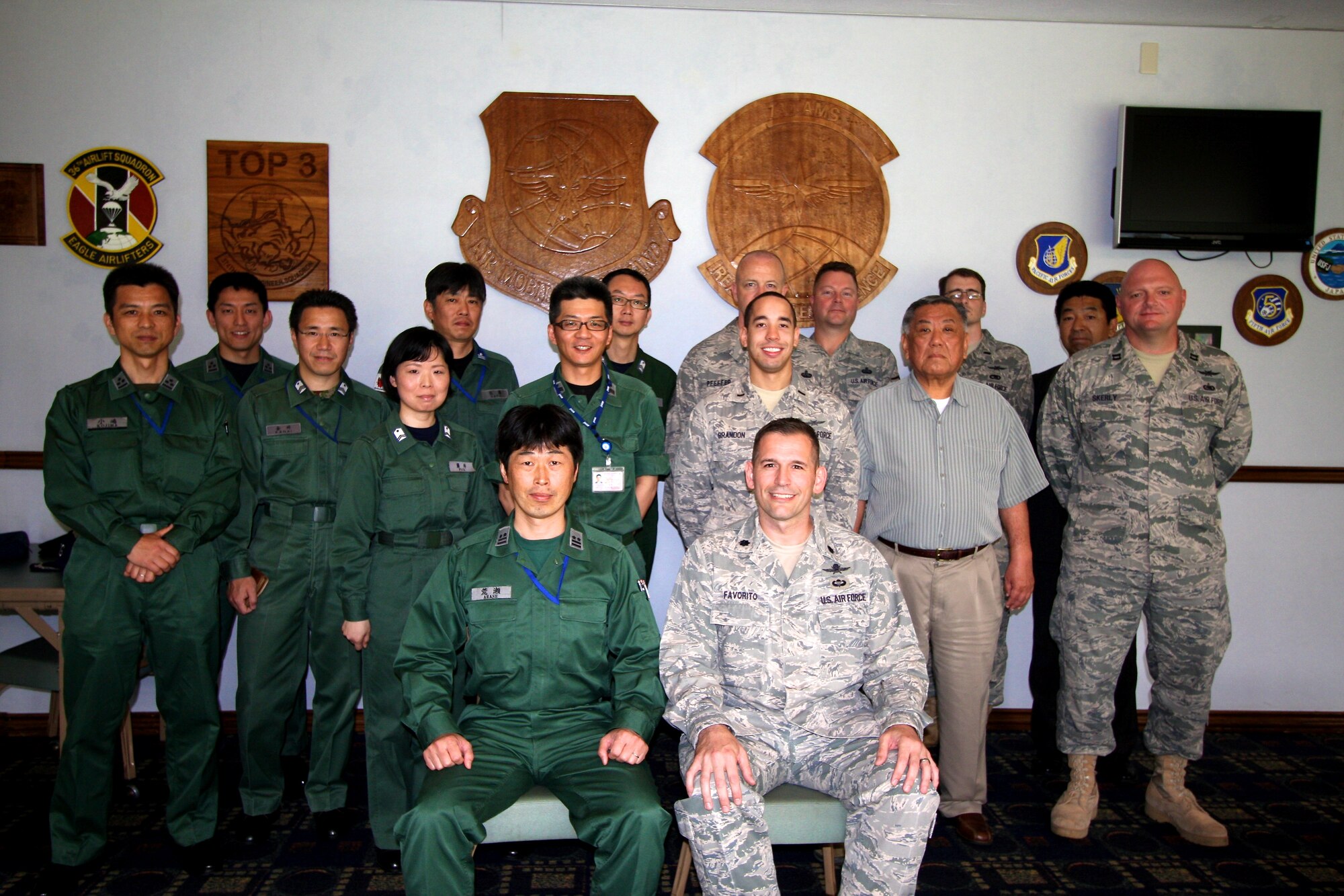 Lt. Col. Hideo Arase (center left) and Lt. Col. Rocky Favorito (center right), 374th Communications Squadron commander, pose for a photo after an informal luncheon at Yokota Air Base, Japan, June 9, 2011. Colonel Arase is the new commander of the Communications and Electronics Squadron, Air Defense Operations Group, Japan Air Self Defense Force. (Courtesy Photo)