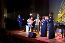 TAIWA TOWN, Japan -- Audience members dance and perform air guitar with Air Force Band of the Pacific-Asia's "Pacific Trends"  vocalists Tech. Sgt. Rebecca Packard and Tech. Sgt. Paula Goetz in Taiwa Town, Japan, June 2011. The band toured Miyagi and Iwate areas, including Sendai City, to bring music and entertainment to Japanese citizens affected by the events of March 11. (Courtesy photo)