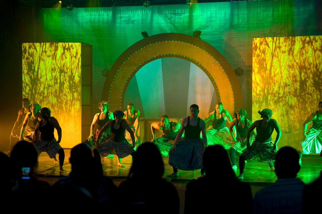 Cast members of the U.S. Army Soldier Show perform for service members in the fitness center on Vogelweh Air Base, Germany, June 8, 2011.