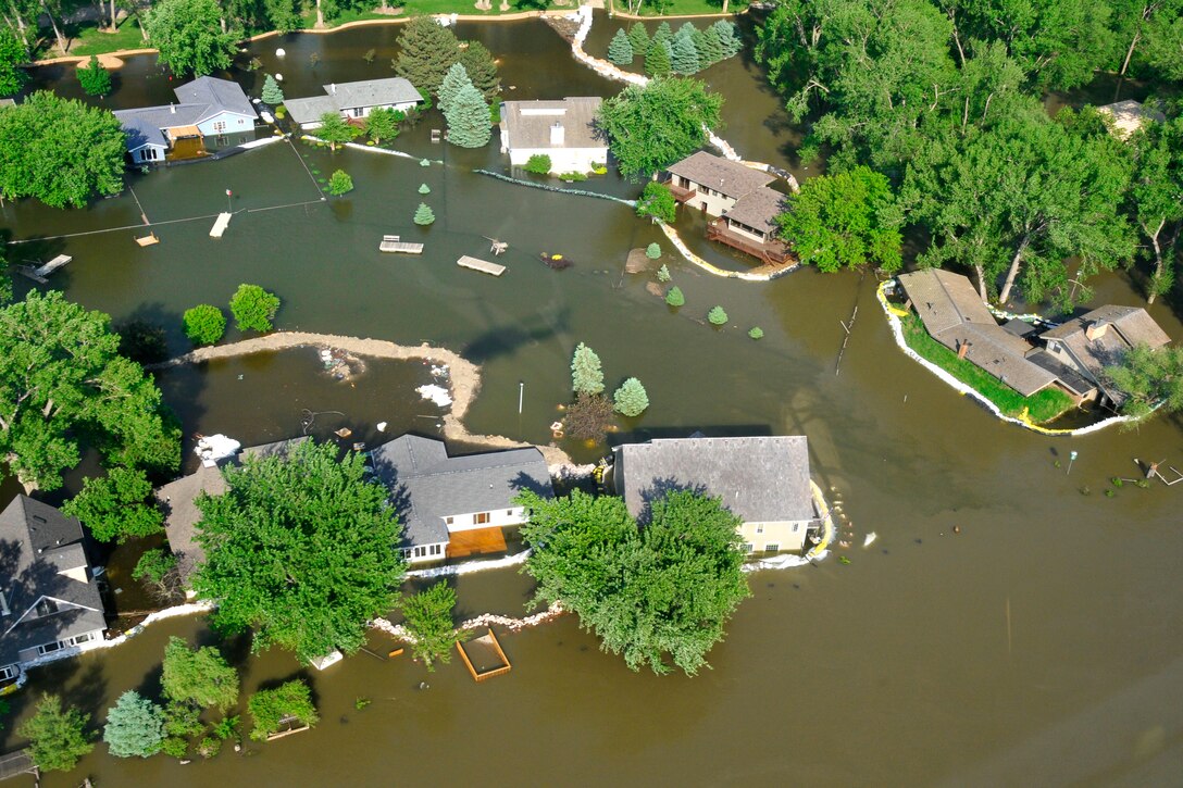 An aerial view shows flooding caused by the Missouri River in Dakota Dunes, S.D., June 8, 2011. Levees were built near homes to prevent property damage. 