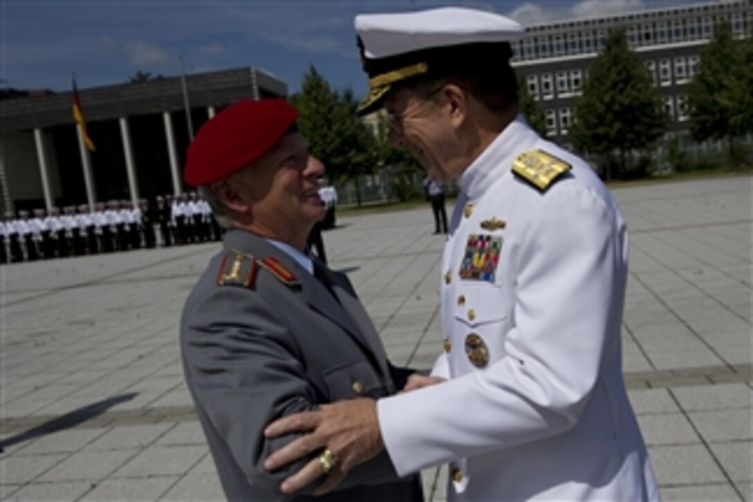 Chairman of the Joint Chiefs of Staff Adm. Mike Mullen greets Chief of Staff of the German Armed Forces Gen. Volker Wieker in Berlin, Germany, on June 9, 2011.  Mullen is on a seven-day trip visiting Egypt and Europe to meet with counterparts and leaders.  