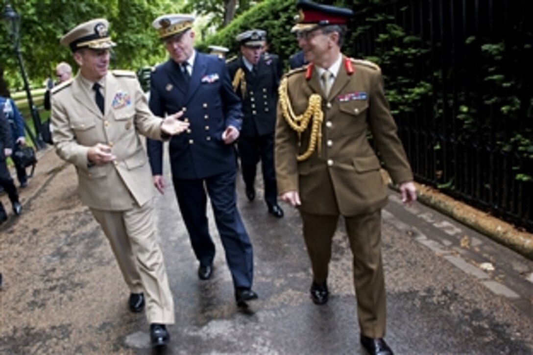 U.S. Navy Adm. Mike Mullen, chairman of the Joint Chiefs of Staff, left, French 
Navy Adm. Edouard Guillaud, chief of Defense Staff, center, and British Gen. Sir David Richards, chief of Defense Staff, right, leave Lancaster House in London, June 10, 2011. 