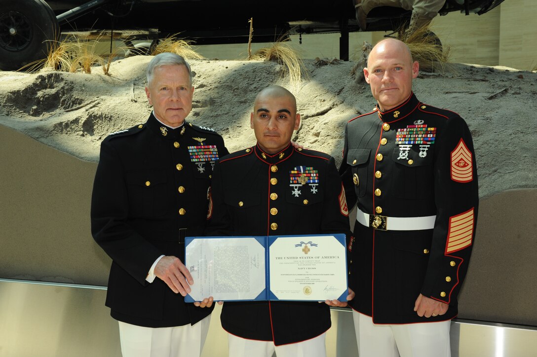 General James F. Amos, Commandant of the Marine Corps, Staff Sergeant Juan J. Rodriguez-Chavez, and Sergeant Major Micheal P. Barrett, Sergeant Major of the Marine Corps, after the Navy Cross Ceremony, June 10, 2011.