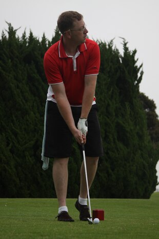 Ryan Chilson, golf-a-thon fundraiser participant, looks down range as he prepares to tee-off during the golf-a-thon fundraiser held at the Torii Pines Golf Course here, June 10, in support of injured and fallen military members. The money earned went toward the Sgt. Elliott fund and the Wounded Warrior Project.