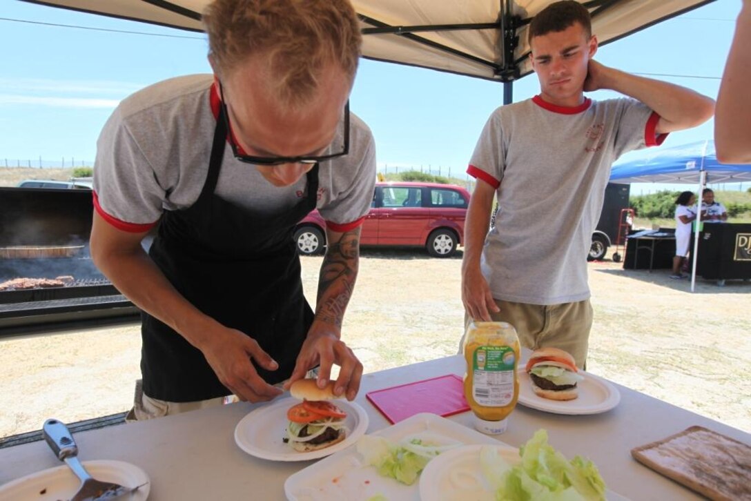 Poole (right) and Kevin Roudin put together their final project for the Burger Battle.::r::::n::::r::::n::