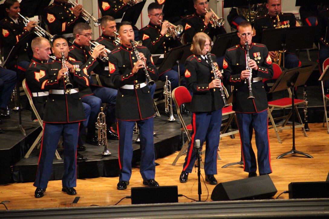 Left to right, Staff Sgt. Rico J. Selbo, Sgt. Benny D. Valenzuela, Cpl. Danielle L. Puchel and Cpl. Steven R. Andrews perform a festive clarinet polka at the Troy Savings Bank concert Hall in Troy, N.Y., June 11. The band uses style of appearance and music to portray an image of the 2nd Marine Aircraft Wing to the general public.