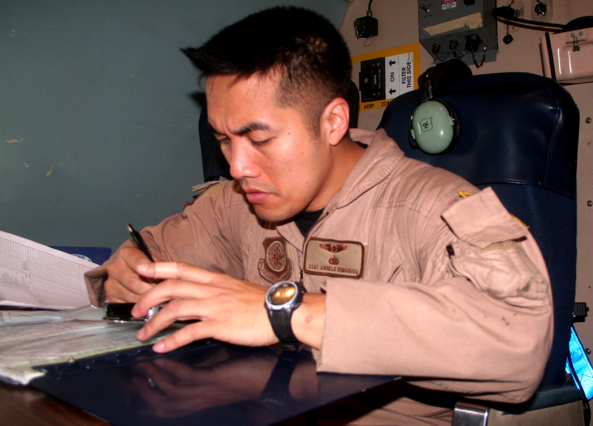 Staff Sgt. Angelo Dumanhog, C-5 Galaxy loadmaster, works in a C-5M Super Galaxy on June 5, 2011, prior to departing for a direct delivery airlift mission through the Arctic Circle from Dover Air Force Base, Del., to Bagram Airfield, Afghanistan. Sergeant Dumanhog was one of 14 crewmembers who flew the mission. He is from the 9th Airlift Squadron at Dover AFB.  (U.S. Air Force Photo/Master Sgt. Scott T. Sturkol)