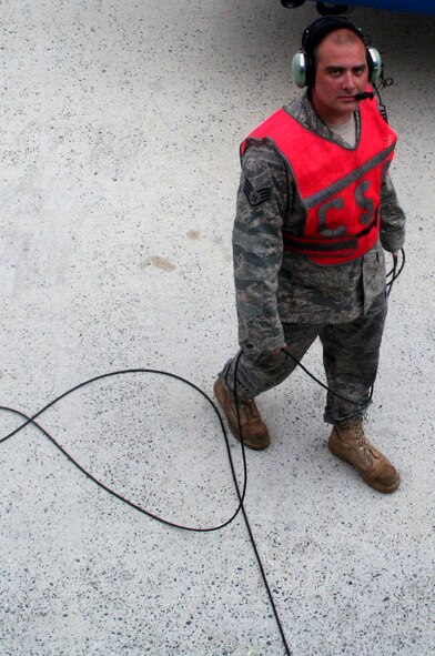 Staff Sgt. Staff Sgt. Nicholas Barker, C-5 Galaxy crew chief from the  436th Aircraft Maintenance Squadron, works on a C-5M Super Galaxy on June 5, 2011, prior to the plane's departure for a direct delivery airlift mission through the Arctic Circle from Dover Air Force Base, Del., to Bagram Airfield, Afghanistan. Sergeant Barker is a native of Plymouth, Mich.  (U.S. Air Force Photo/Master Sgt. Scott T. Sturkol)
