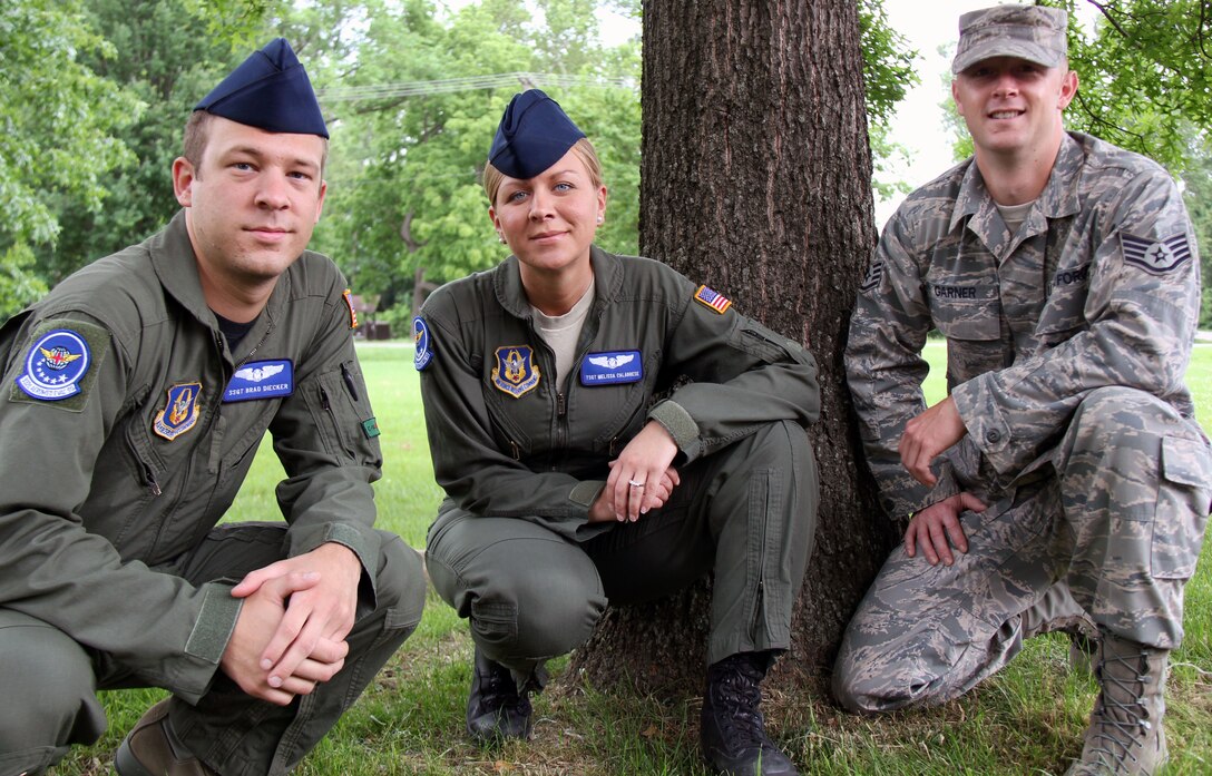 (From left) Staff Sgt. Bradley Diecker, Tech. Sgt. Melissa Calabrese and Staff Sgt. Jason Garner back home after helping with the Joplin tornado recovery operation.(U.S. Air Force photo/Tech. Sgt. Dan Oliver) 