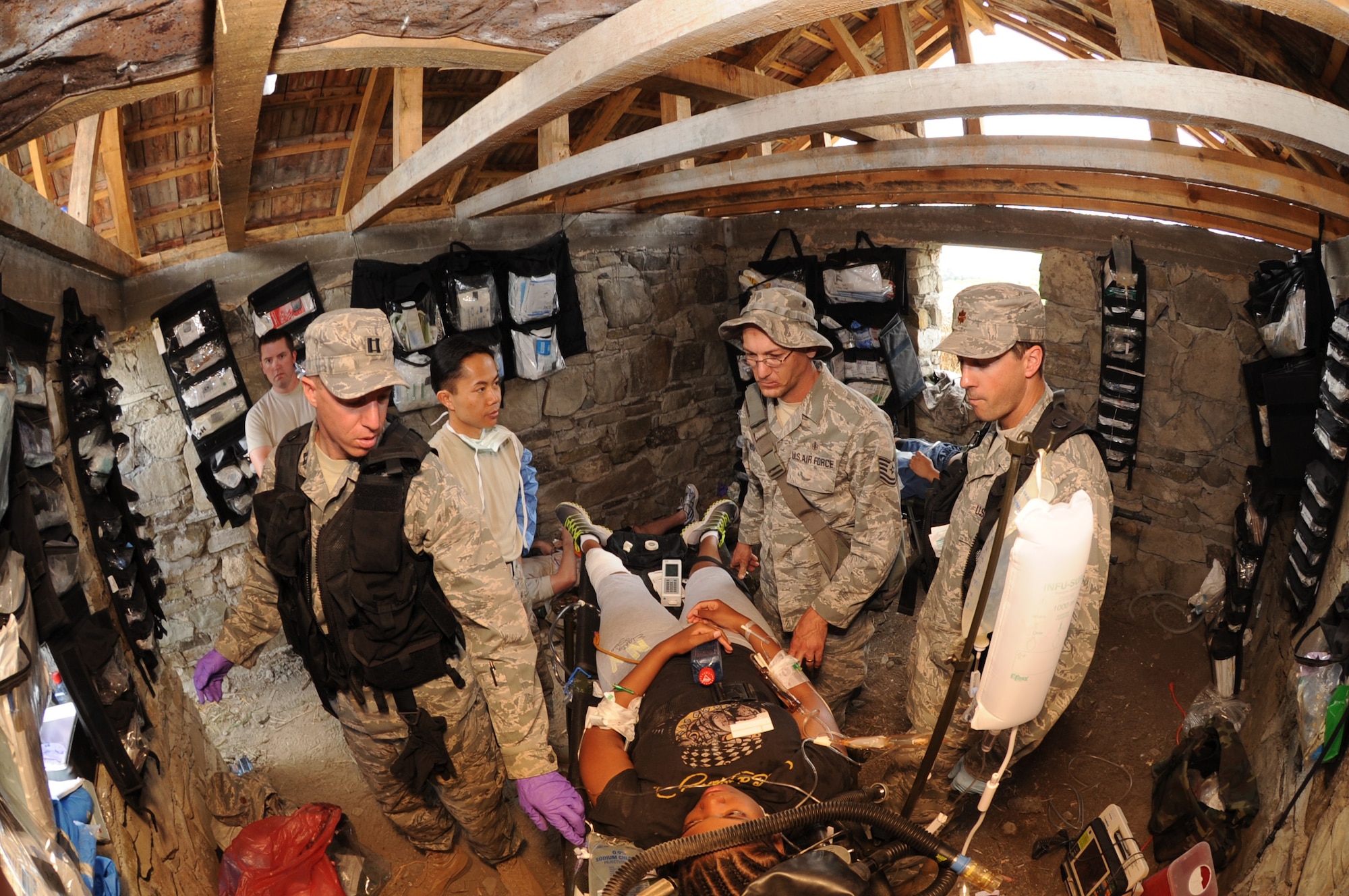 KRIVOLAK, Macedonia -- Medical personnel with the U.S. Air Forces in Europe provide simulated mudslide victims with medical assistance during the 2011 Medical Training Exercise in Central and Eastern Europe Initial Contengiency Response Team training day June 10. The annual Chairman of the Joint Chiefs of Staff-sponsored regional and multilateral exercise, MEDCEUR is designed to provide medical training and operational experience in a deployed environment for U.S. and partner nations. The countries participating in this year's MEDCEUR are Macedonia, Montenegro, Bosnia and Herzegovina, Serbia, Slovenia and Norway. (U.S. Air Force photo/Staff Sgt. Nadine Y. Barclay)