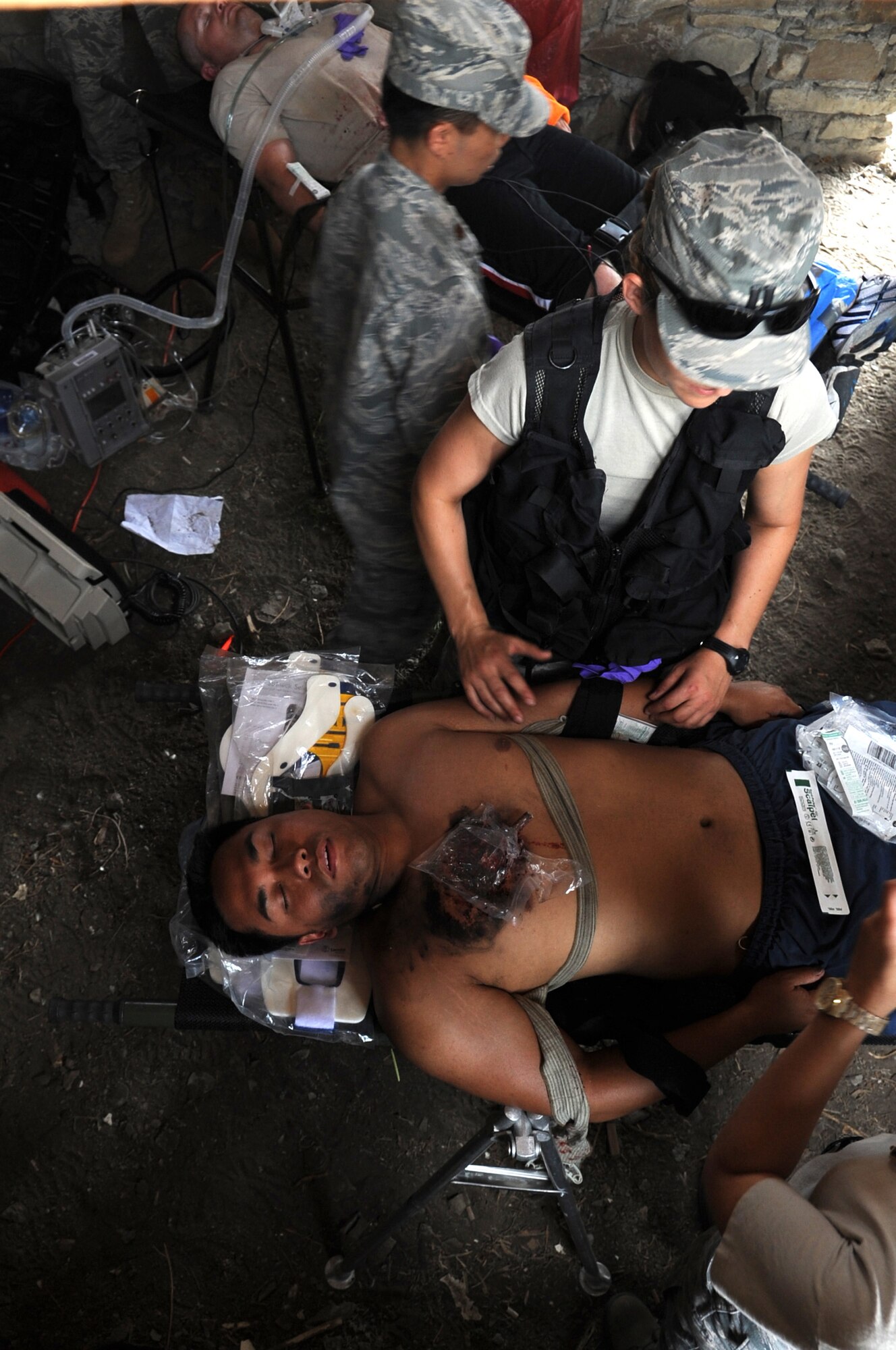 KRIVOLAK, Macedonia -- Medical personnel with U.S. Air Forces in Europe provide patients with simulated medical assistance during the 2011 Medical Training Exercise in Central and Eastern Europe Initial Contengiency Response Team training day June 10. The annual Chairman of the Joint Chiefs of Staff-sponsored regional and multilateral exercise, MEDCEUR is designed to provide medical training and operational experience in a deployed environment for U.S. and partner nations. The countries participating in this year's MEDCEUR are Macedonia, Montenegro, Bosnia and Herzegovina, Serbia, Slovenia and Norway. (U.S. Air Force photo/Staff Sgt. Nadine Y. Barclay)