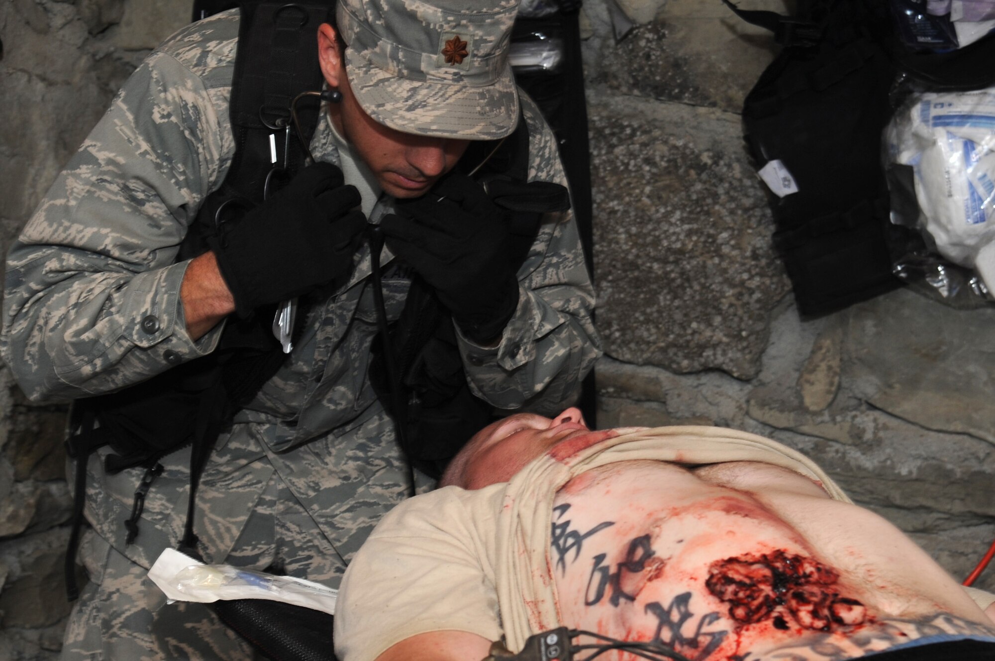 KRIVOLAK, Macedonia -- Maj. Kevin Webb, 31st Medical Group nurse anesthetist from Aviano Air Base, Italy, prepares to check a simulated patient?s breathing during the 2011 Medical Training Exercise in Central and Eastern Europe Initial Contengiency Response Team training day June 10. The annual Chairman of the Joint Chiefs of Staff-sponsored regional and multilateral exercise, MEDCEUR is designed to provide medical training and operational experience in a deployed environment for U.S. and partner nations. The countries participating in this year's MEDCEUR are Macedonia, Montenegro, Bosnia and Herzegovina, Serbia, Slovenia and Norway. (U.S. Air Force photo/Staff Sgt. Nadine Y. Barclay)