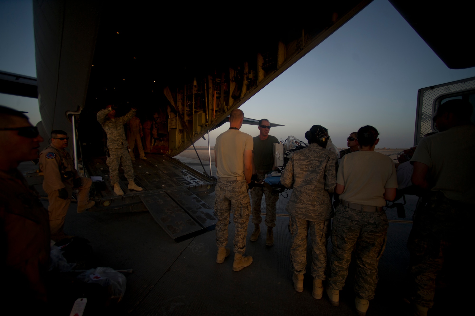 Members from the 451st Expeditionary Aeromedical Evacuation Squadron Detachment 1 Contingency Aeromedical Staging Facility load a wounded Marine onto a C-130 Hercules at Camp Bastion, Afghanistan. The CASF team is responsible for taking care of and transporting patients from the staging facility and role hospital to aircraft who are then transported to the next level of medical care. (U.S. Air Force photo/Master Sgt. Adrian Cadiz)(RELEASED)