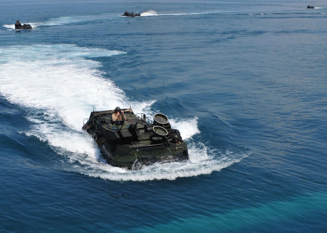An amphibious assault vehicle approaches the well deck of the transport dock ship USS Tortuga (LSD 46) to load aboard after an exercise for Cooperation Afloat Readiness and Training (CARAT) Malaysia 2011, June 12. The ship is currently deployed for CARAT 2011, which is a series of bilateral exercises held annually in Southeast Asia to strengthen relationships and enhance force readiness.