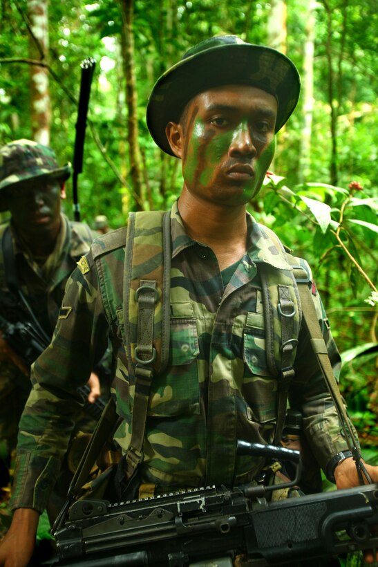 ERAM SISIK TRAINING AREA, KEMAMAN TERENGGANU, MalaysiaMalaysian Army Rangers patrol through Eram Sisik June 11 while training with U.S. Marines as part of Cooperation Afloat Readiness and Training (CARAT) 2011. CARAT is an annual series of bilateral exercises held between the U.S. and Southeast Asian nations with the goals of enhancing regional cooperation, promoting mutual trust and understanding, and increasing operational readiness throughout the participating nations.  While in Malaysia, U.S. and Malaysian service members trained together on jungle, urban and amphibious operations.