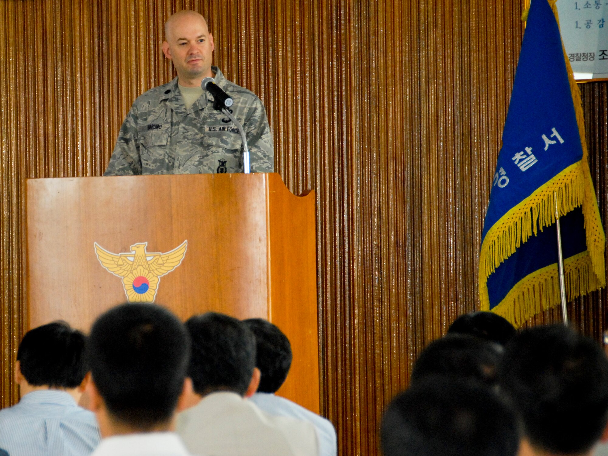 GUNSAN CITY, Republic of Korea -- Lt. Col. Mark Anarumo, 8th Security Forces Squadron commander, delivers a presentation to the Gunsan City Korean National Police here June 7. Colonel Anarumo addressed an audience of more than 220 KNP and outlined the routine activity theory. (U.S. Air Force photo/1st Lt. Trisha Eldredge)