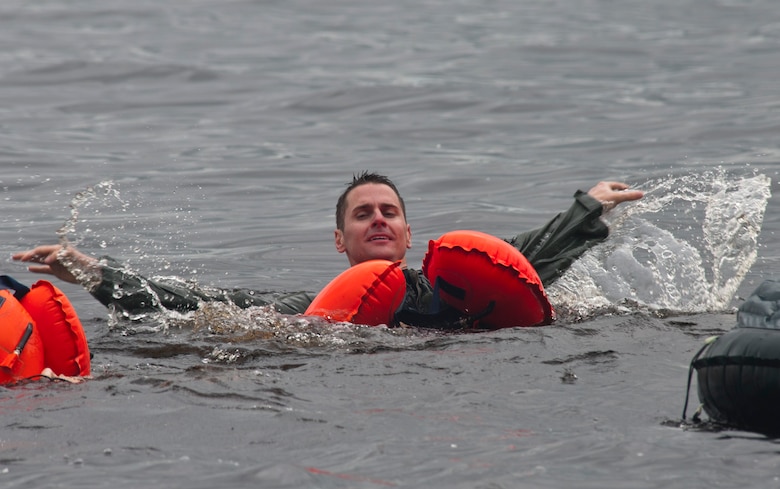 1st Lt. Christopher Smith 109th Airlift Squadron, Minnesota Air National Guard swims in the St. Croix River wearing an aircrew life preserver Afton State Park, Hastings Minn. June 11, 2011. Sixty-two members of the 133rd Airlift Wing, Minnesota Air National Guard are taking part in their annual survival training at Afton State Park, Hastings Minn. including survival equipment, lift raft familiarization, parachute disentanglement and rescue techniques. U.S. Air Force Photo by Tech. Sgt. Erik Gudmundson (released)