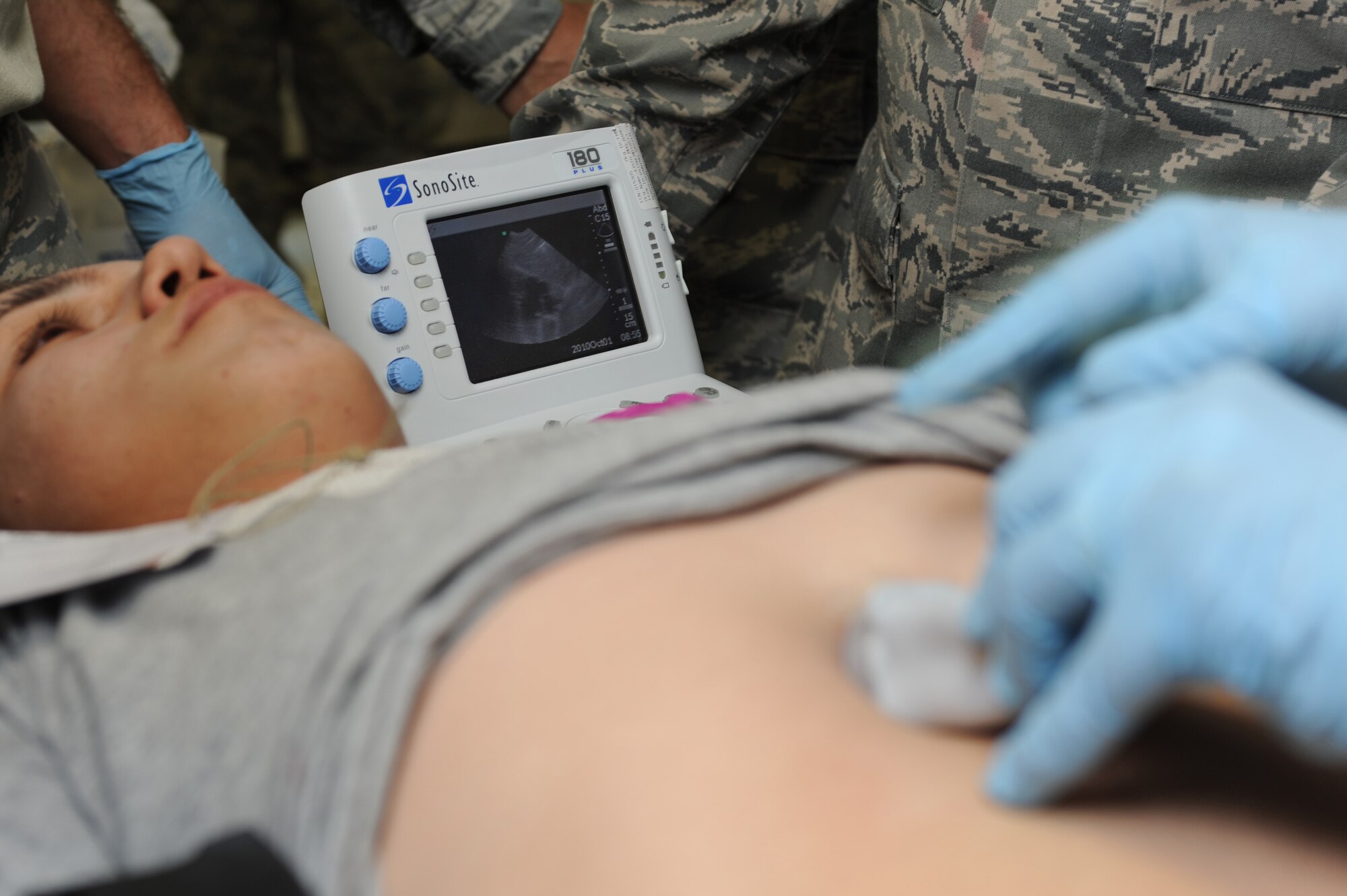 CAMP PEPELISHTE, Macedonia -- U.S. medical personnel perform an ultrasound on a patient in preparation for a simulated surgery during the 2011 Medical Training Exercise in Central and Eastern Europe live exercise June 11. An annual Chairman of the Joint Chiefs of Staff-sponsored regional and multilateral exercise, MEDCEUR is designed to provide medical training and operational experience in a deployed environment for U.S. and partner nations. The countries participating in this year's MEDCEUR are Macedonia, Montenegro, Bosnia and Herzegovina, Serbia, Slovenia and Norway. (U.S. Air Force photo/Staff Sgt. Nadine Y. Barclay)
