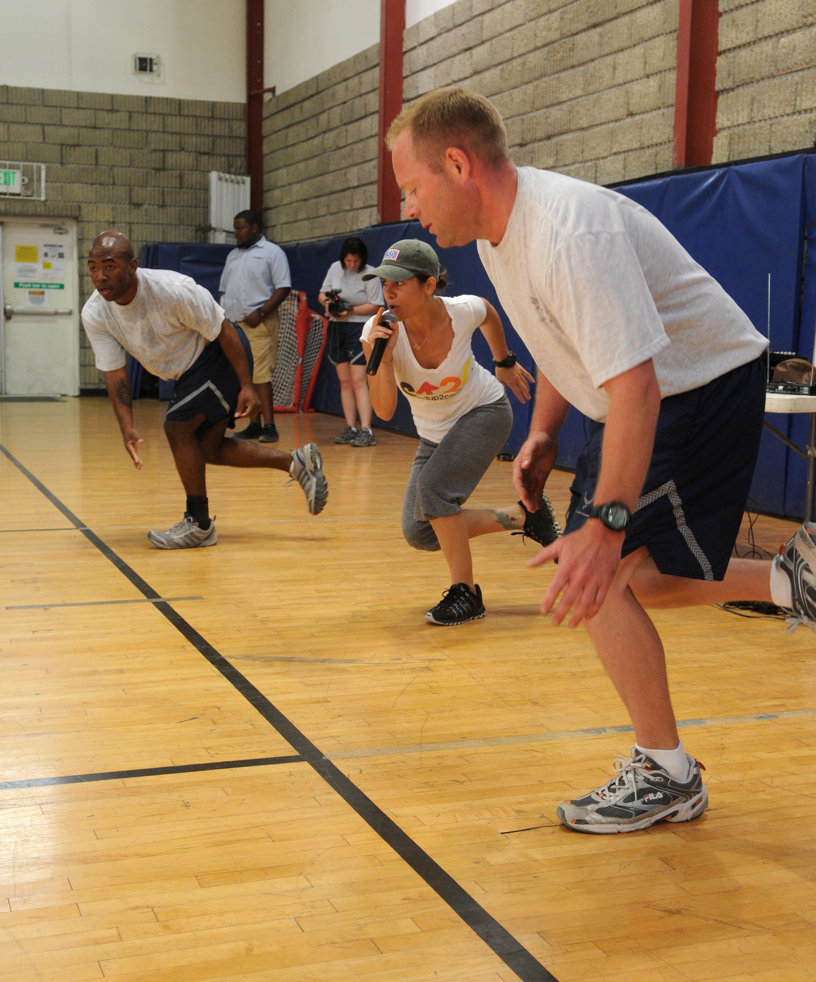 Biggest Loser star Jillian Michaels leads a workout session for members of the 379th Air Expeditionary Wing June 9 in Southwest Asia. Ms. Michaels was part of the first USO Fitness Tour. (U.S. Air Force photo/ Staff Sgt. Anthony Graham)