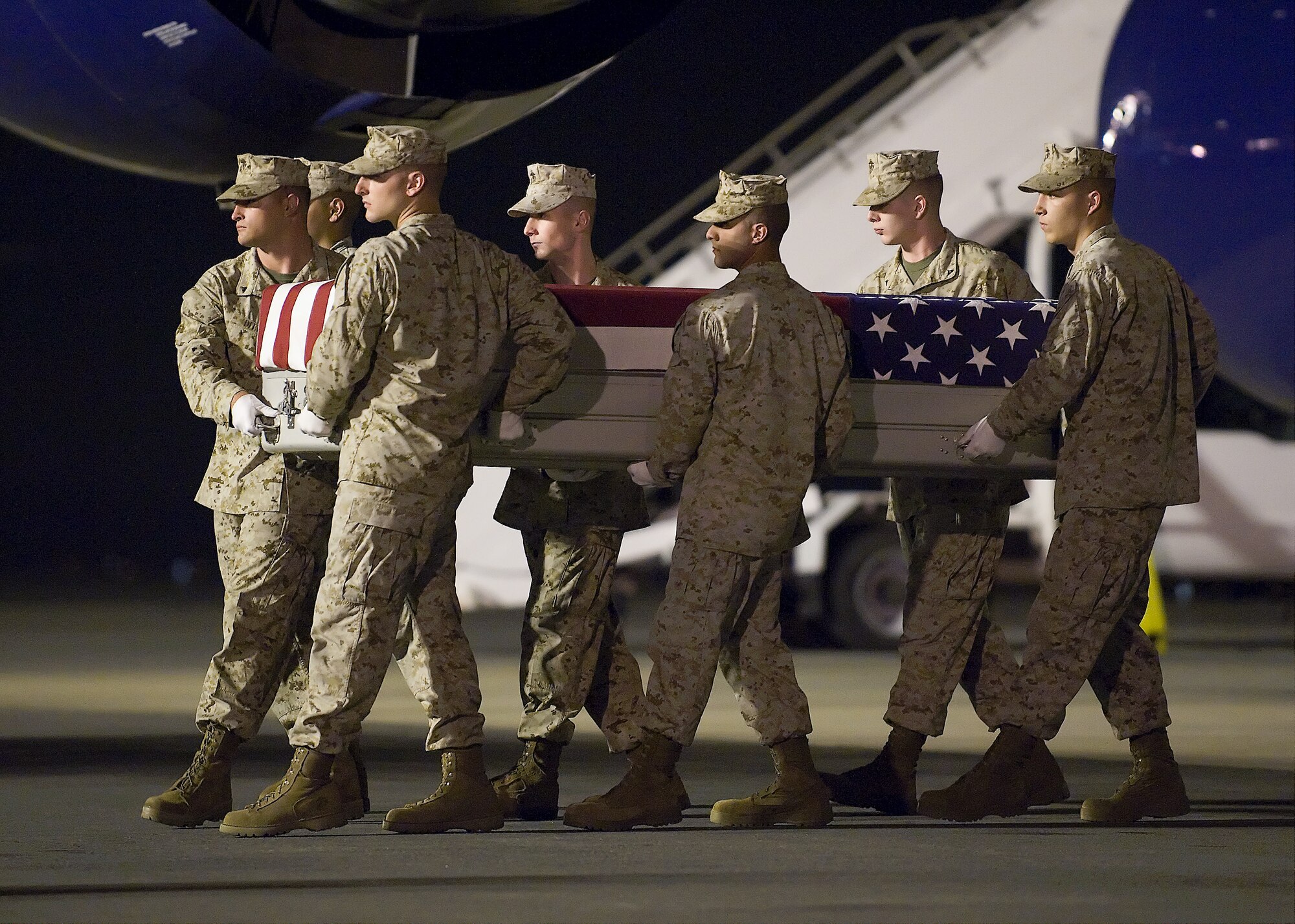 A U.S. Marine Corps carry team transfers the remains of Marine Cpl. Matthew T. Richard, of Acadia, La., at Dover Air Force Base, Del., June 12, 2011. Richard was assigned to the 2nd Battalion, 8th Marine Regiment, 2nd Marine Division, II Marine Expeditionary Force, Camp Lejeune, N.C. (U.S. Air Force photo/Steve Kotecki)